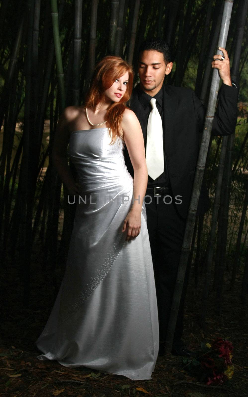 Sexy couple standing in bamboo forest by mahnken