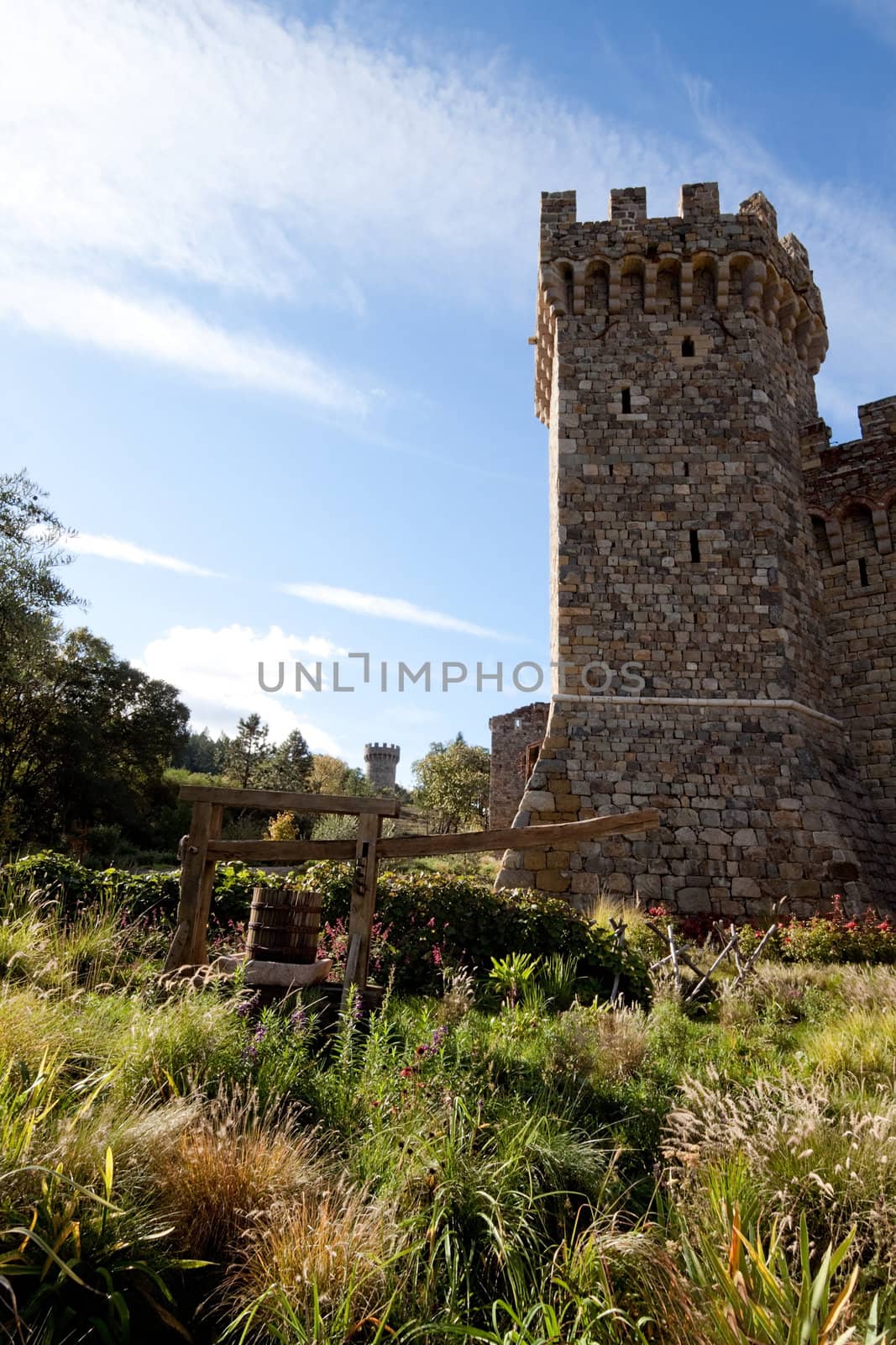 A tower made of stone that is part of a castle