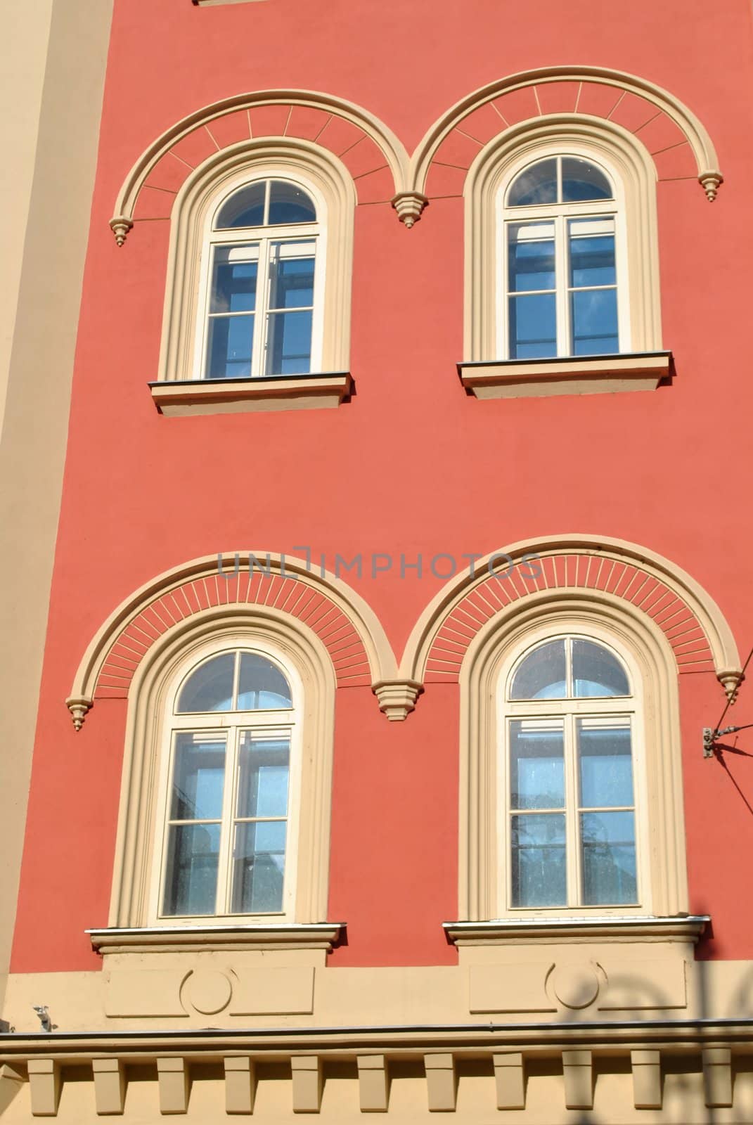 four windows on the facade of palladium shopping center of prague