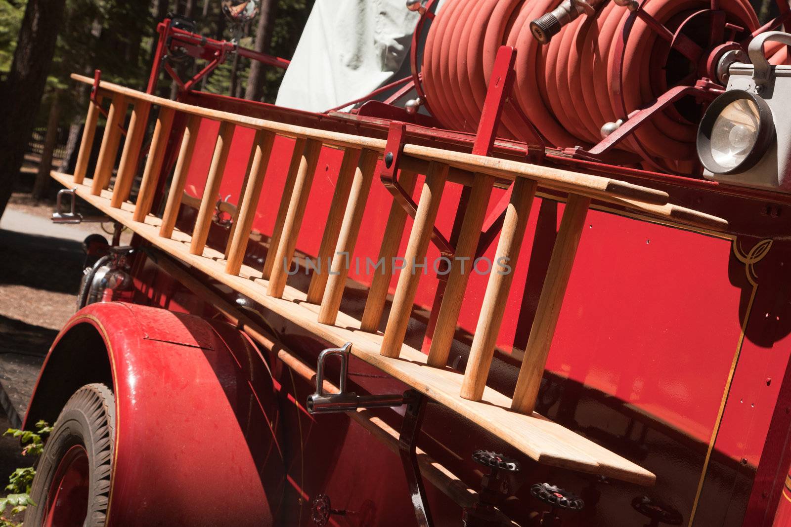 Vintage Red Fire Truck with Latter and Hose.