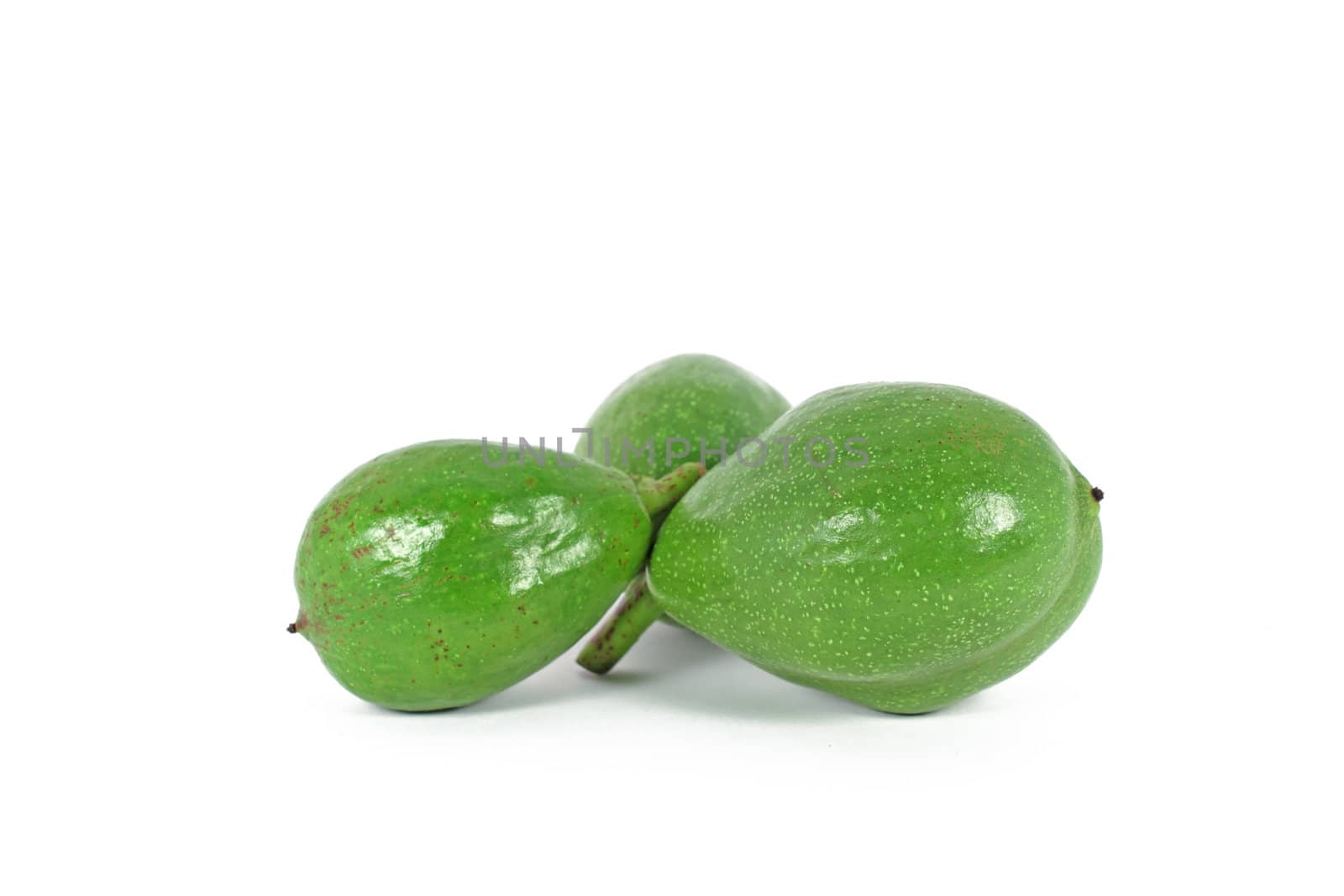 Unripe, green walnuts isolated on white