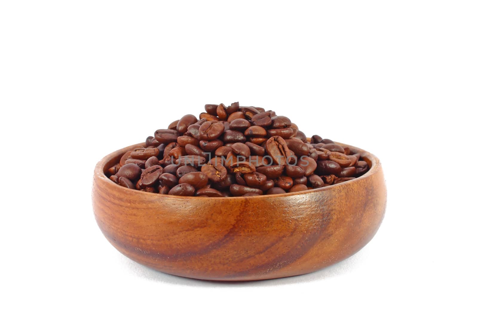 Coffee beans in wooden bowl isolated on white