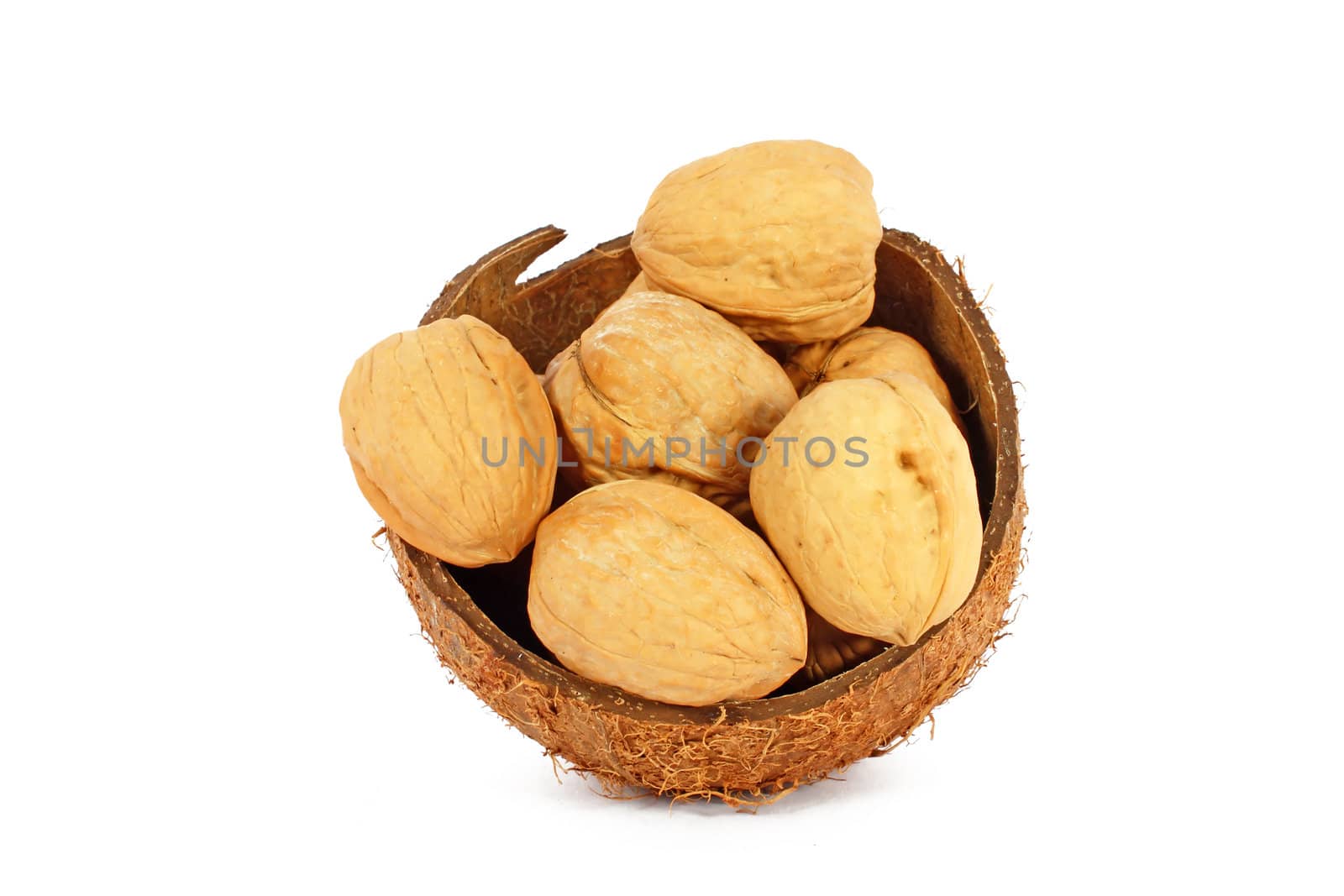 Walnuts in coco shell isolated on white