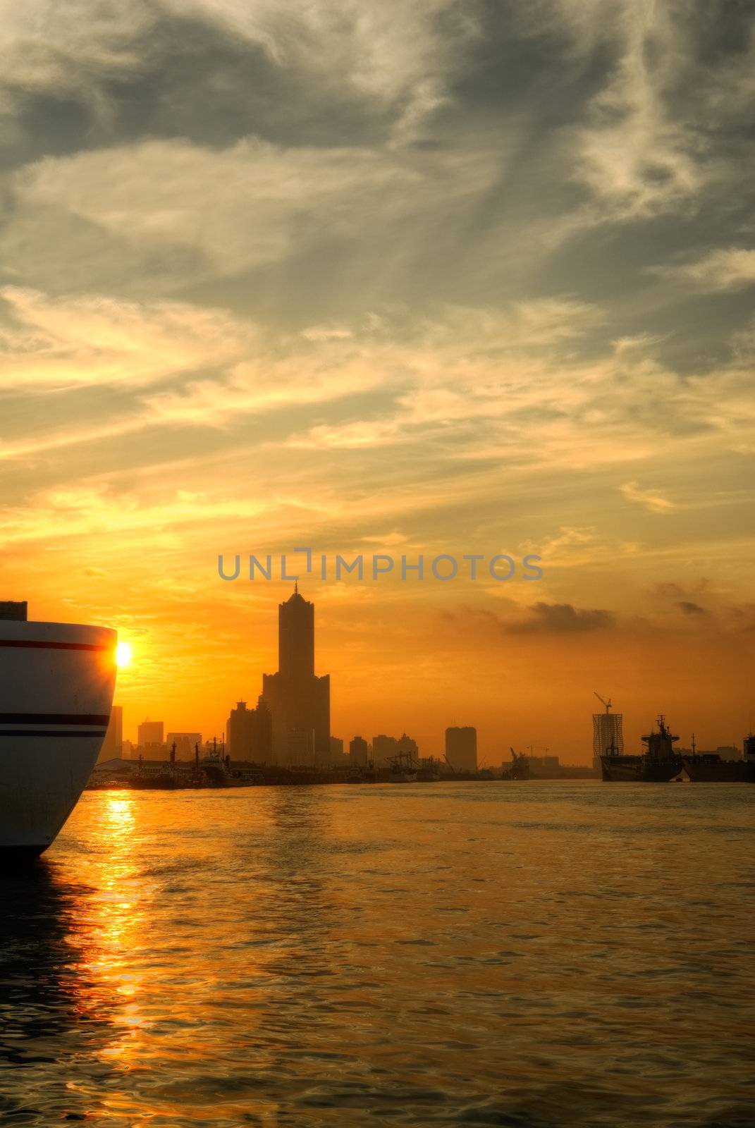 City morning in Kaohsiung dock with silhouette of skyscraper and buildings, Taiwan.