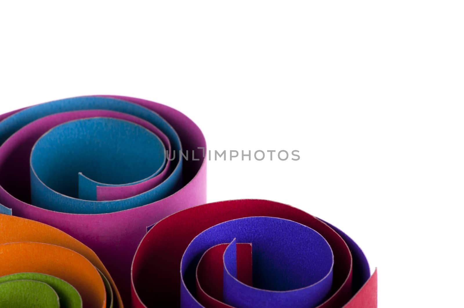 Multi-colored craft paper rolls isolated on white background