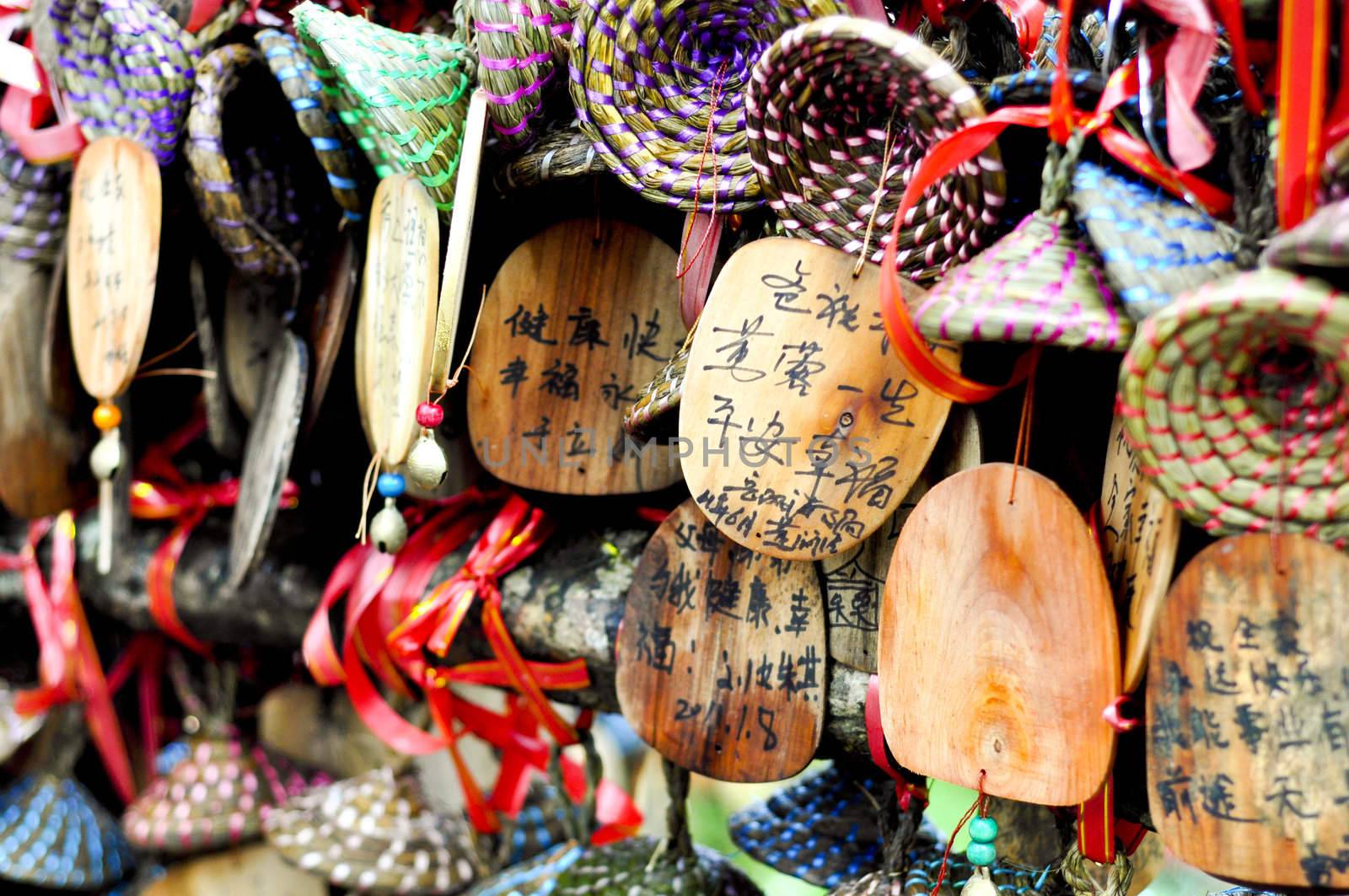 close-up of colorful wooden buddhist prayer tablets in lijiang, China also seen on the show "Amazing Race"