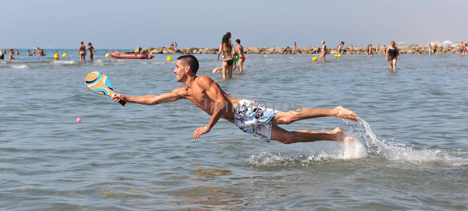 beach tennis in the sea by cynoclub