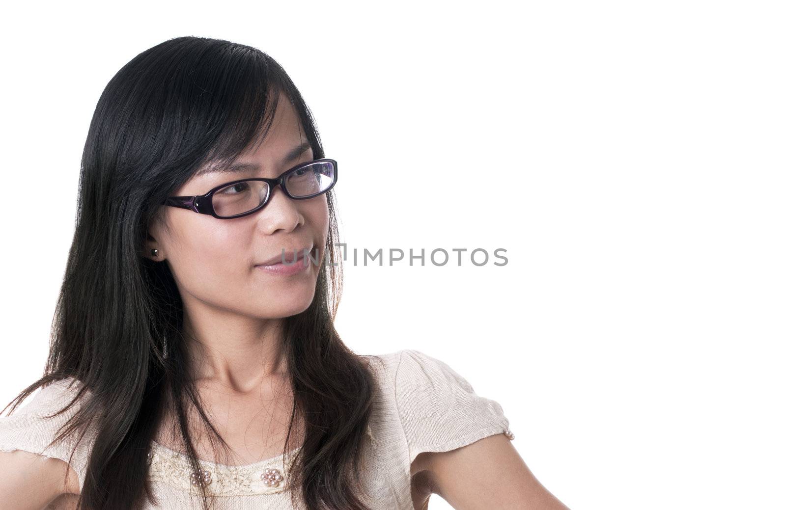 An confused female with black glasses and blak hair with hands on her hips against white background