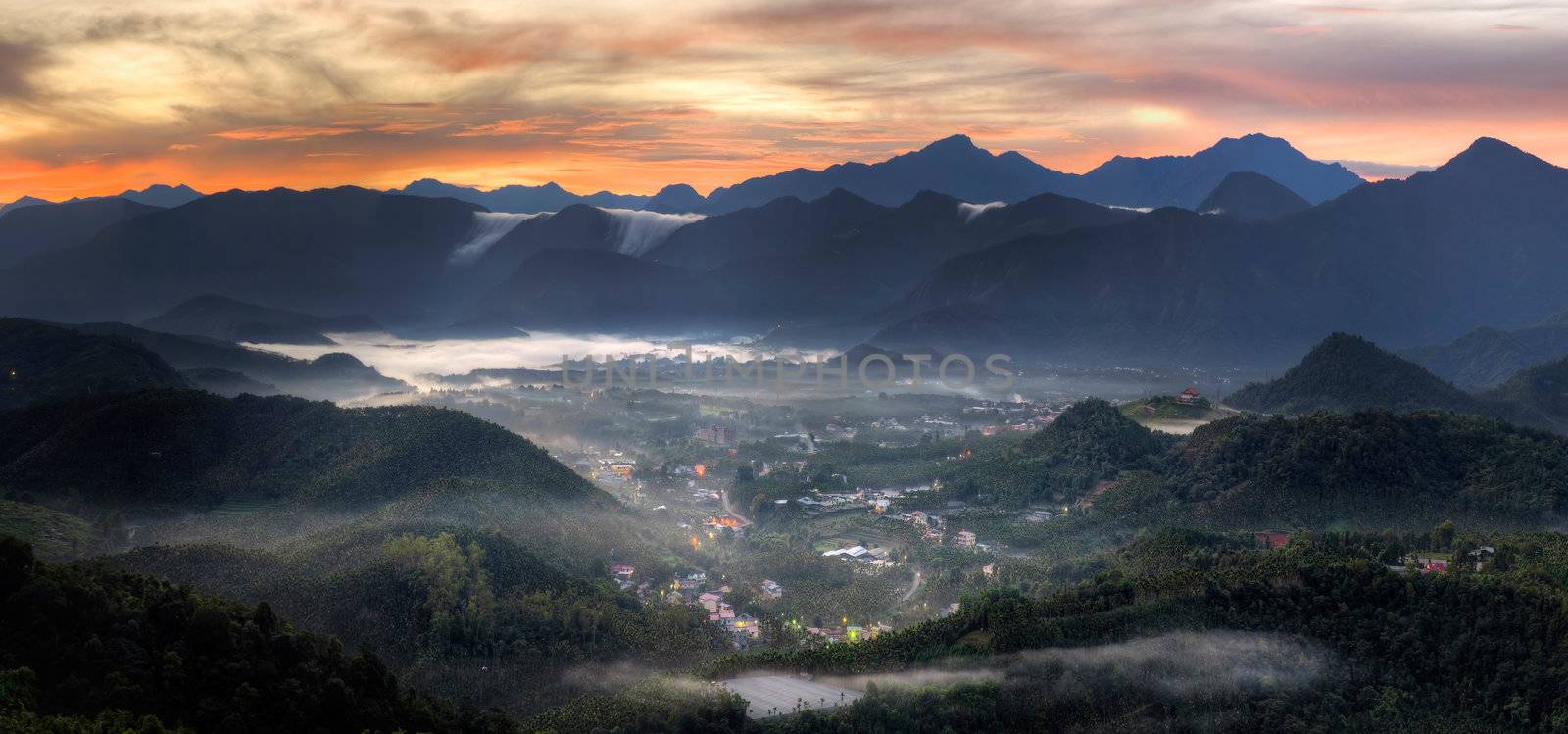 Village in mountain, morning scenery with dramatic sunrise and fog in forest, Taiwan, Asia.