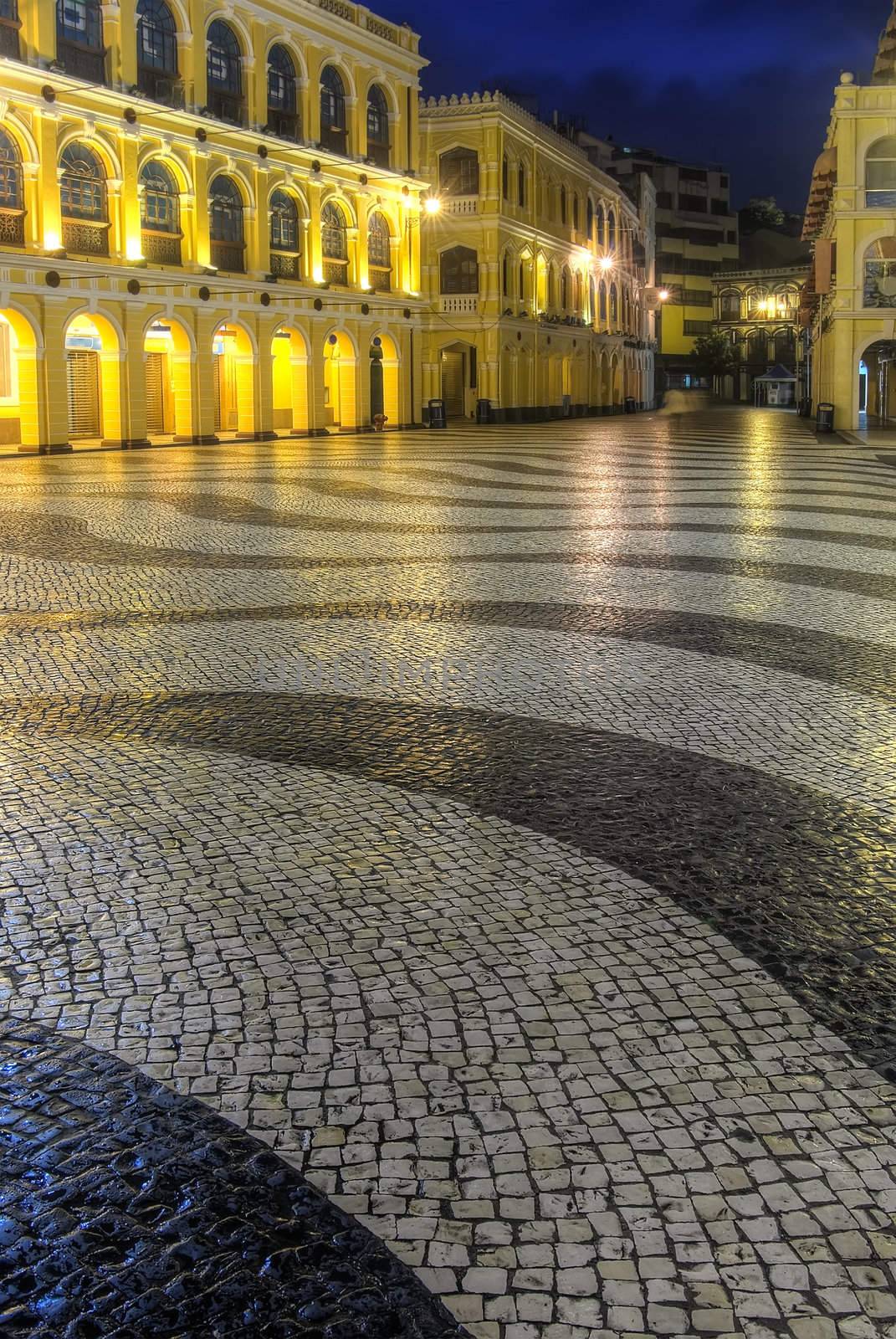 City scenery in night with street and buildings in Macao, China.