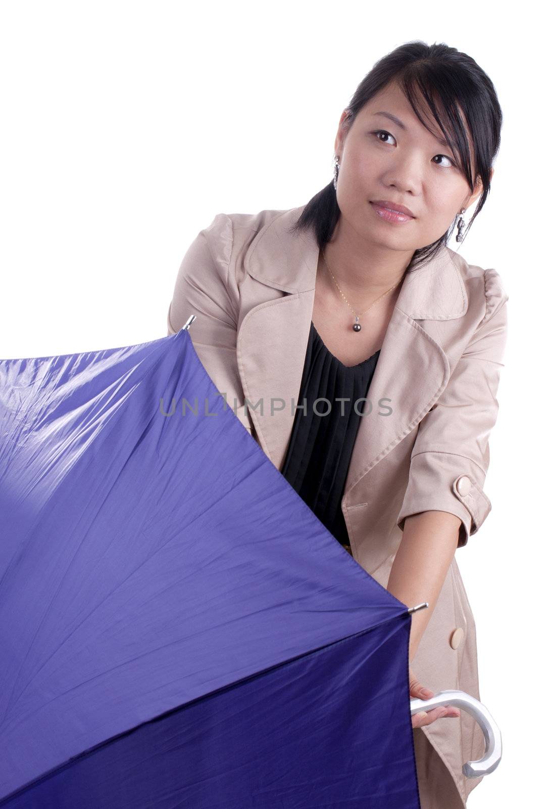 Young asian woman holding umbrella wondering if it will start raining