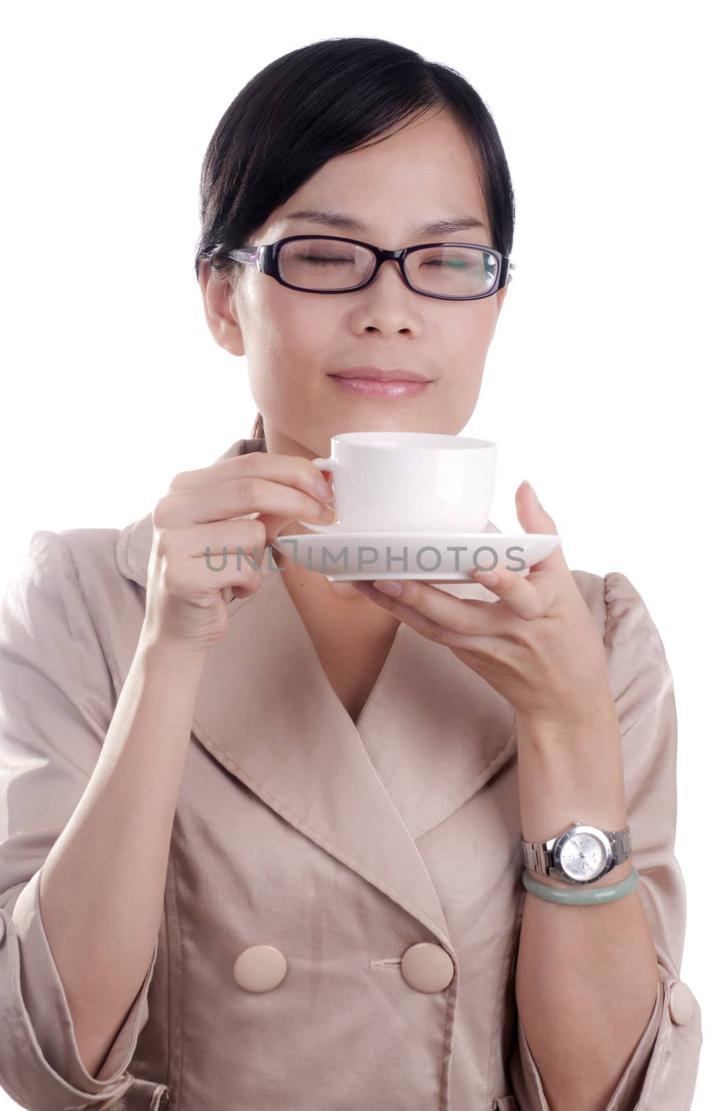 Asian business woman about to enjoy her morning cup of coffee before work isolated