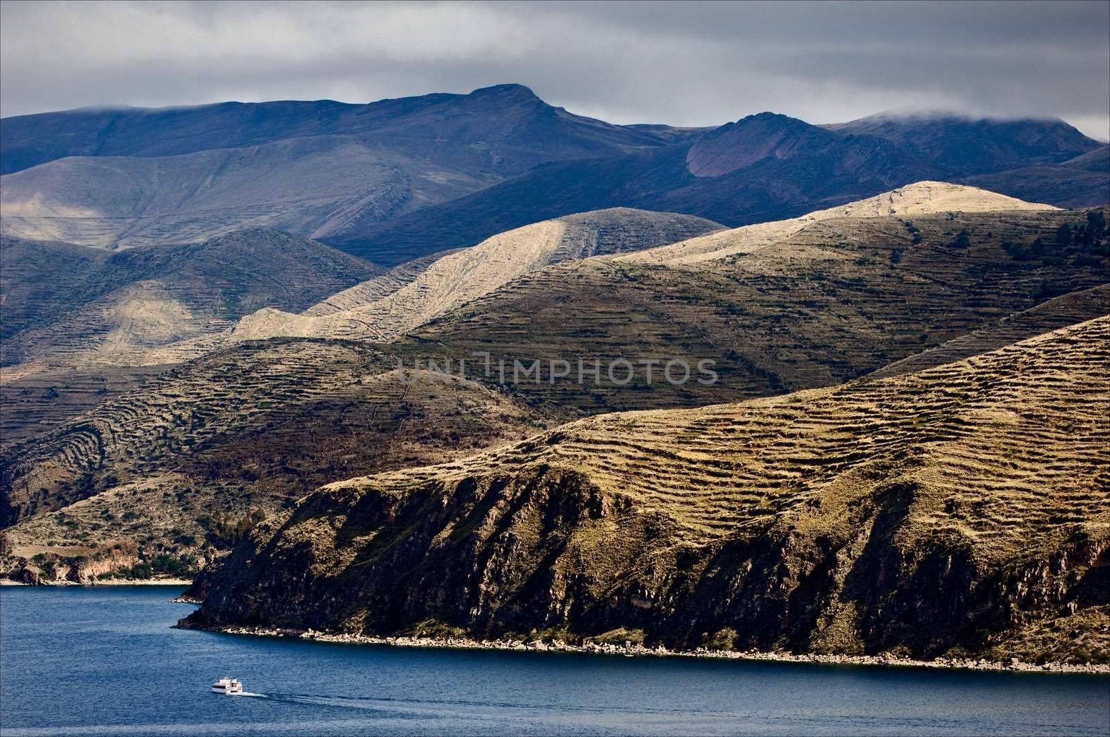 Bewitching kind from sun island on Titicaca lake  and the ship floating on him.