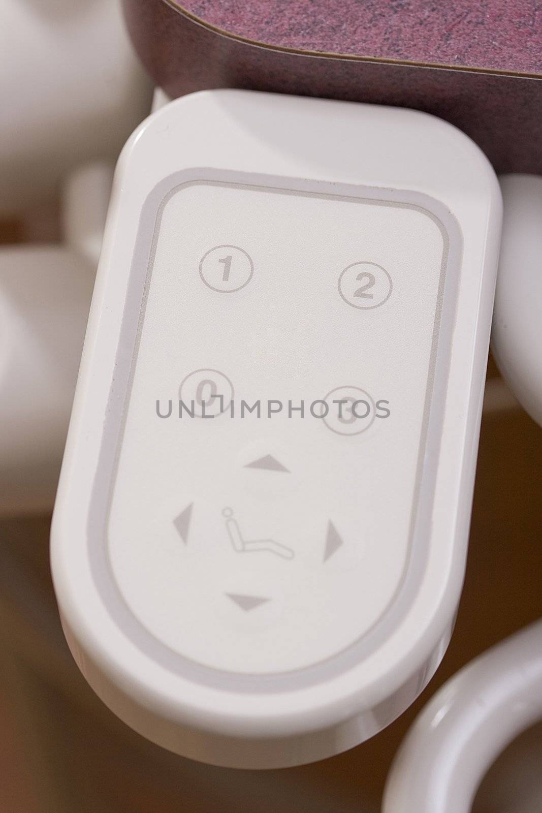 Close-up of a remote control to a dentist chair.