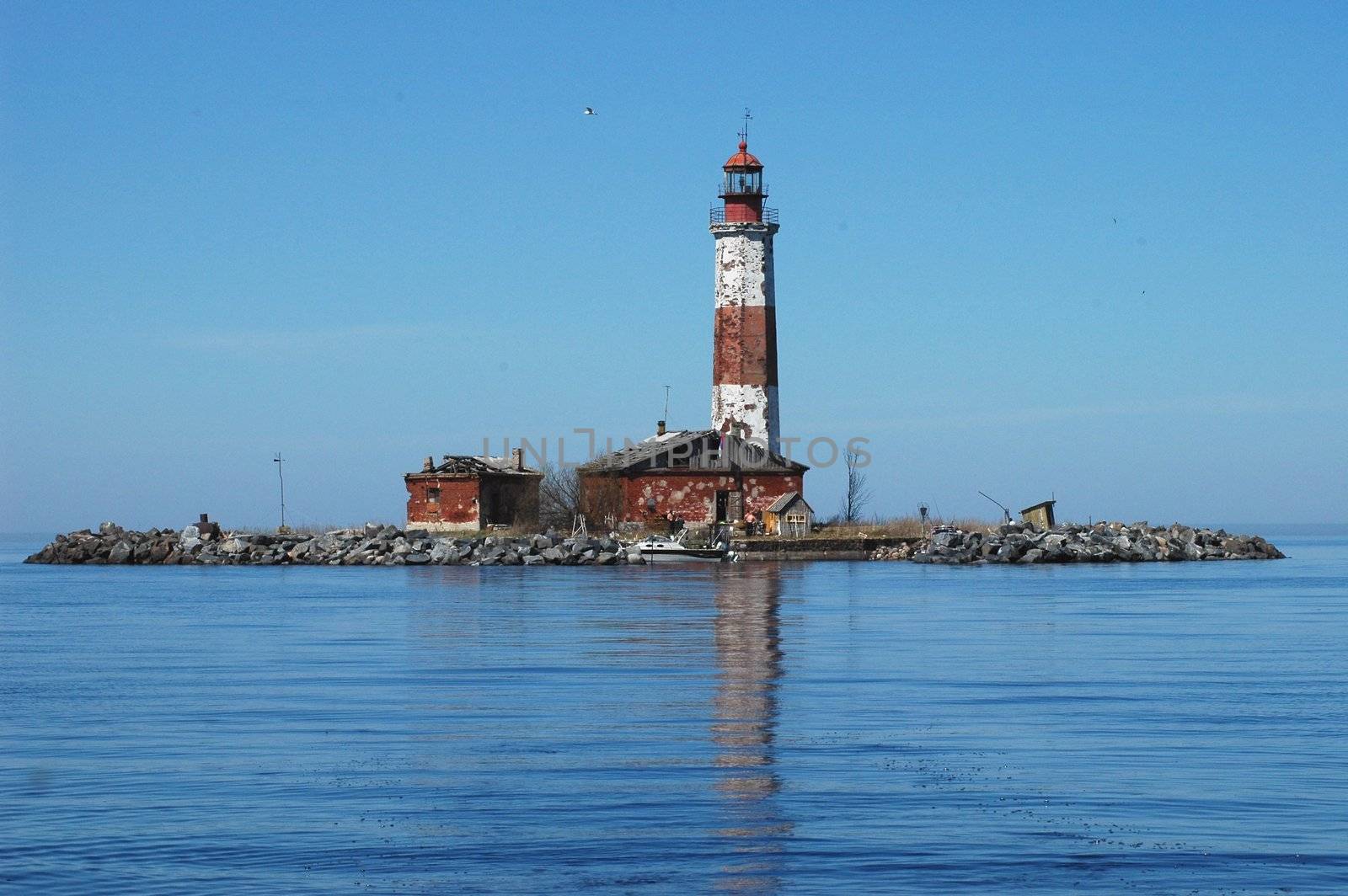 Old beacon. The old beacon on island Suho in Ladoga lake stands alone. Russia.