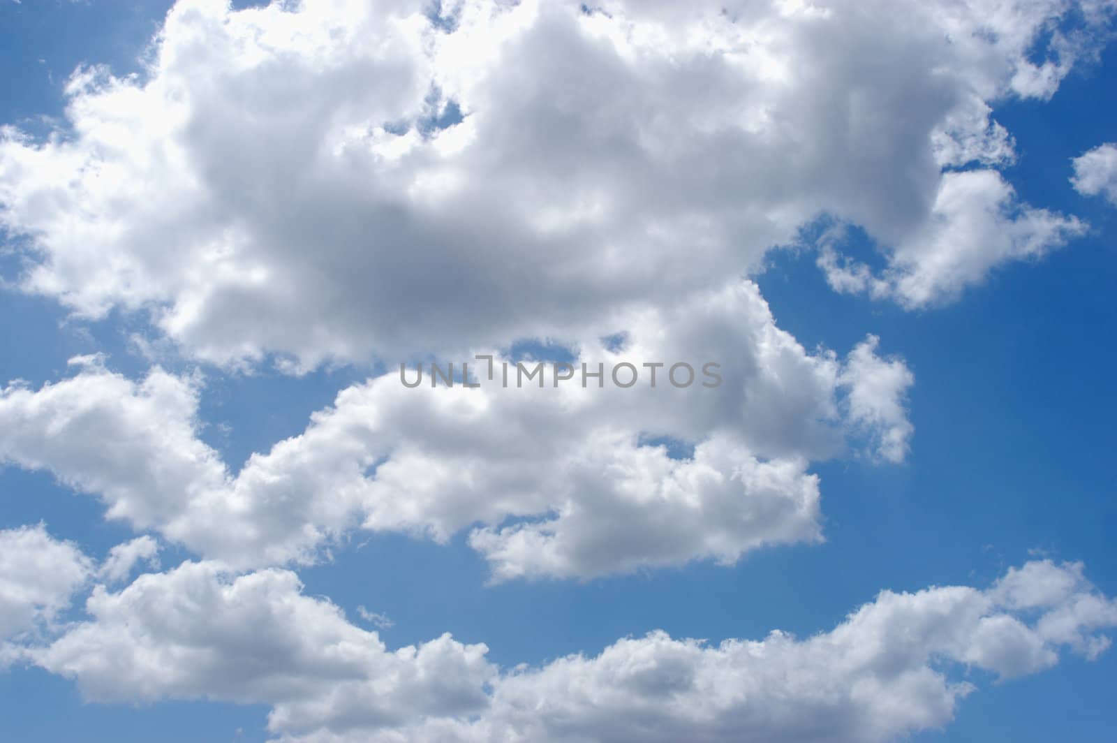 blue sky with puffy white clouds