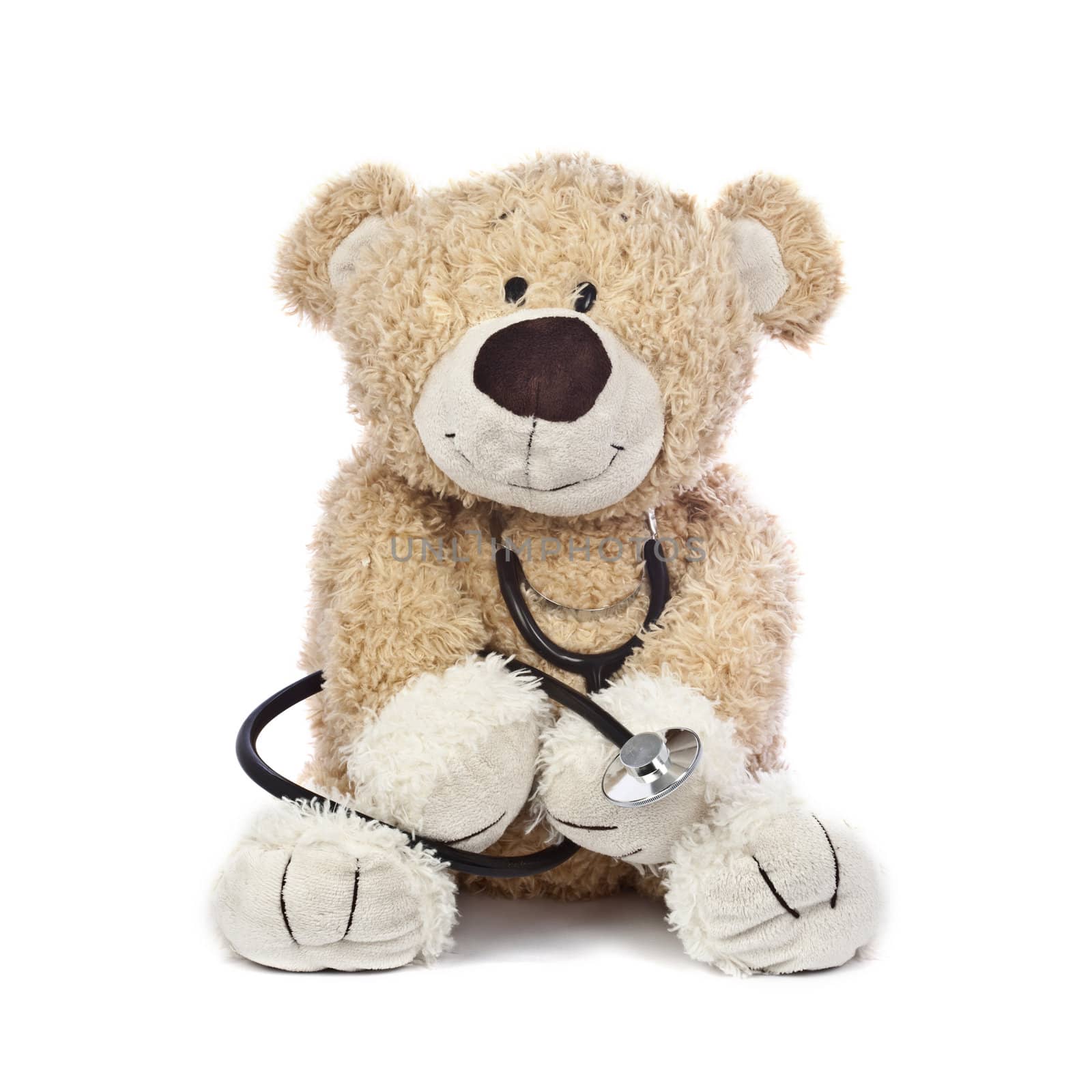 An adorable teddy bear, isolated on white, holding a stethoscope.