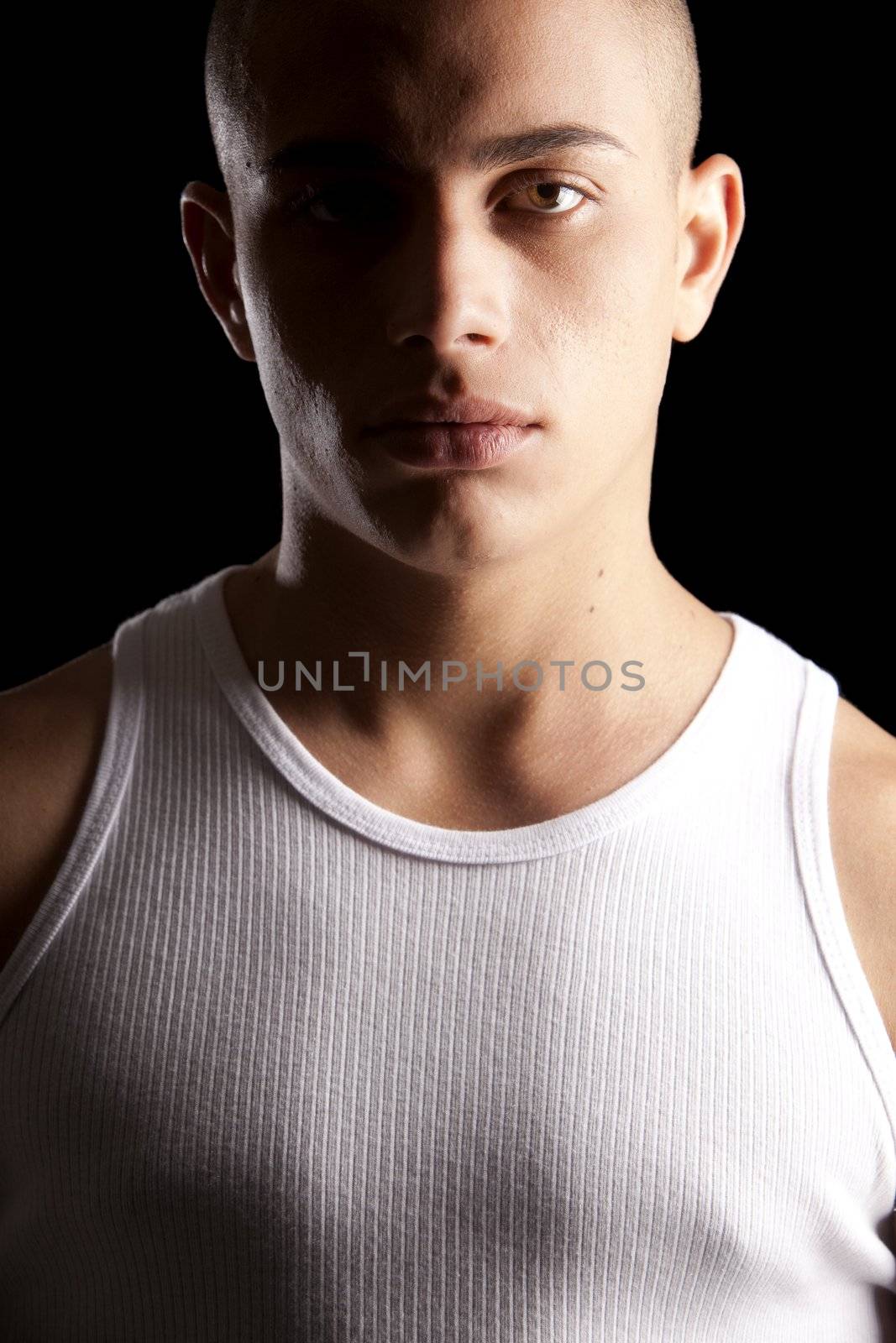A good looking, muscular built, man on a black background.