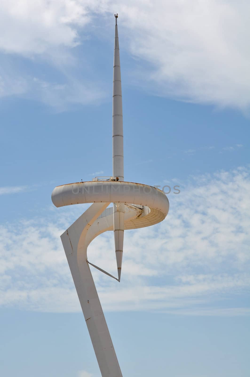 Communication Tower in Barcelona Spain with Blue Sky Background
