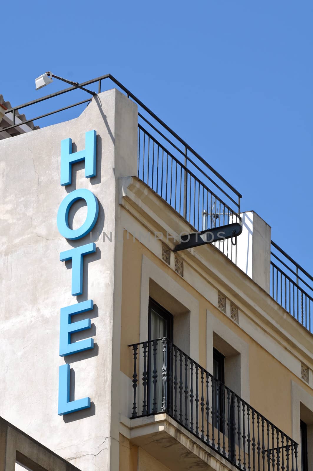 Hotel Sign on Old Building with Blue Sky