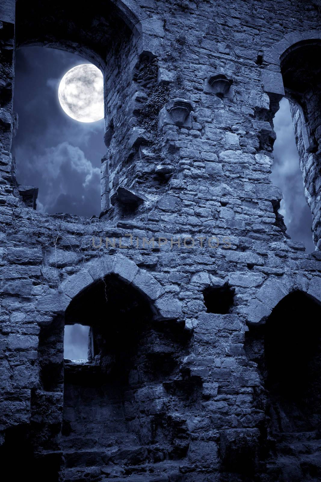 A very spooky Halloween castle in the moonlight
