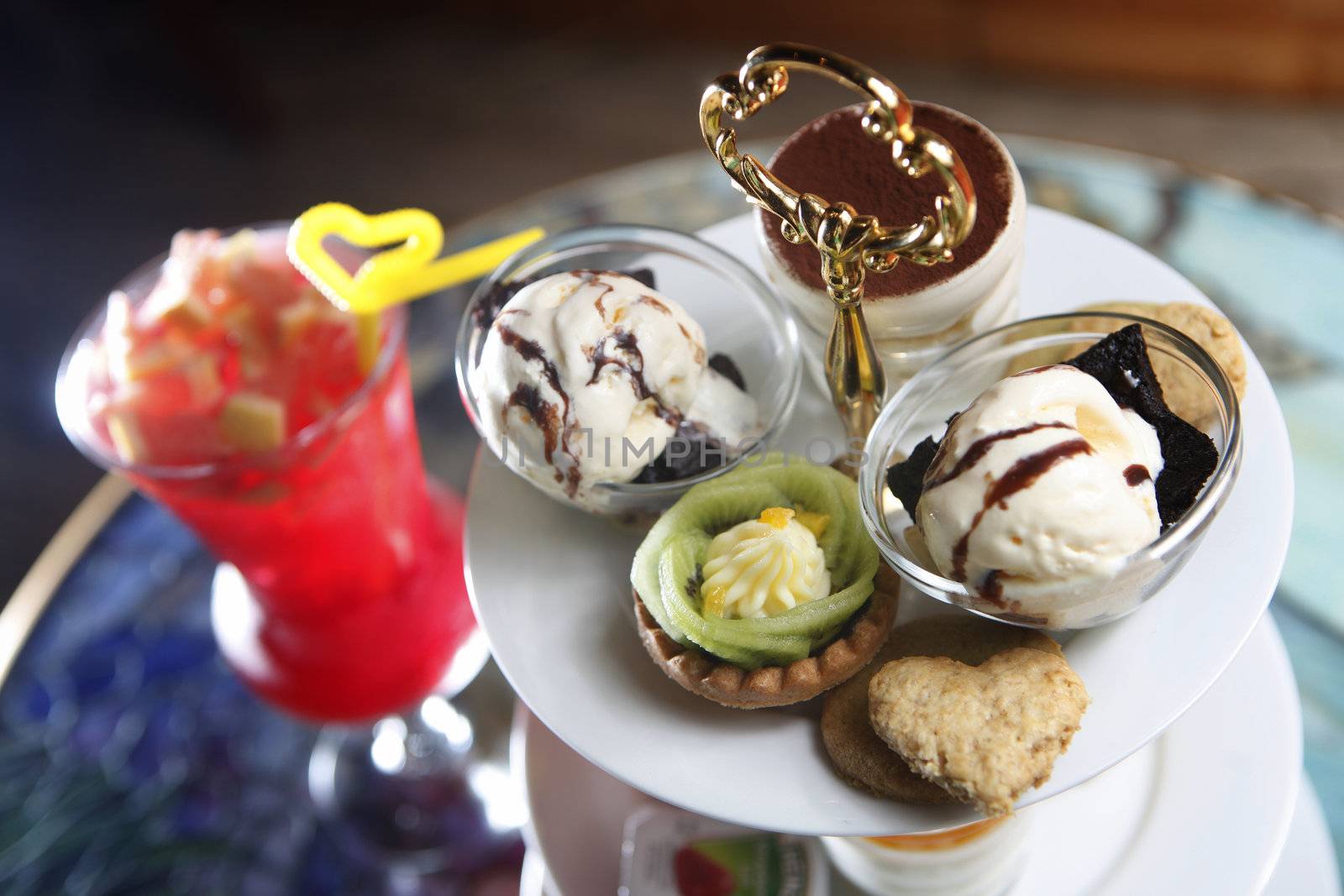 A serving bowl with sweets and cookies for a high tea.