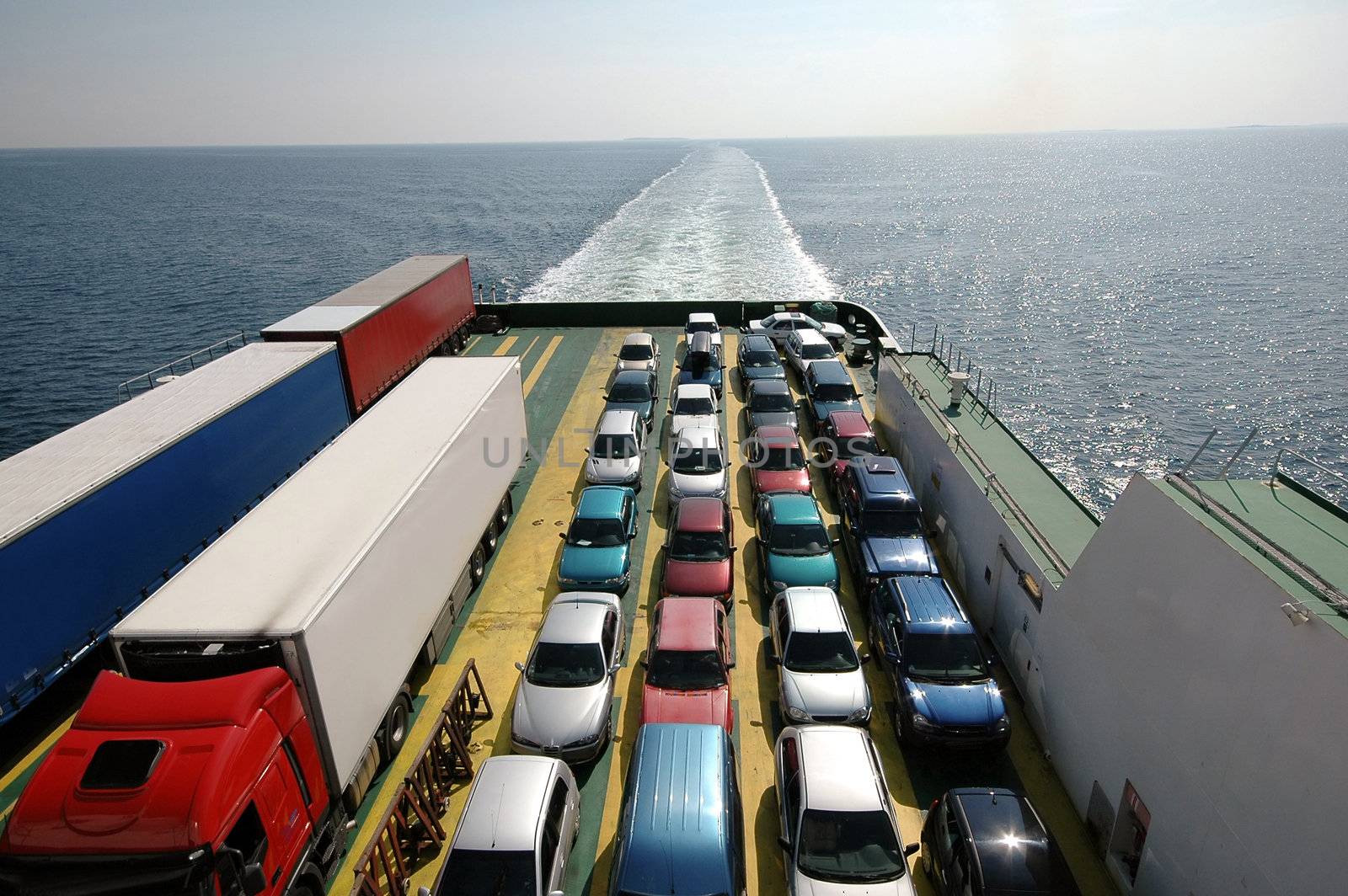 Cars parked on a ferry.