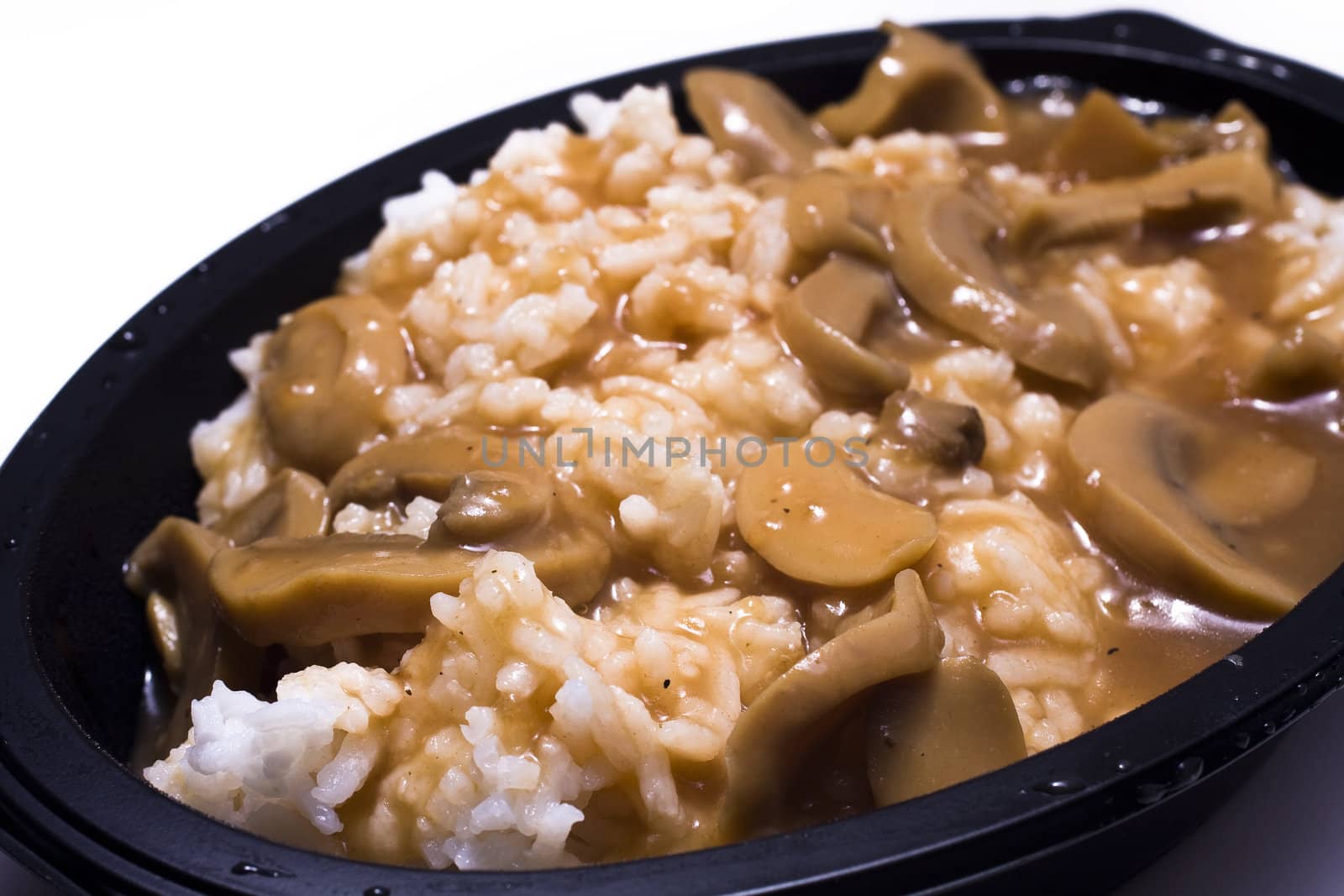 Mushrooms and rice on the white background  