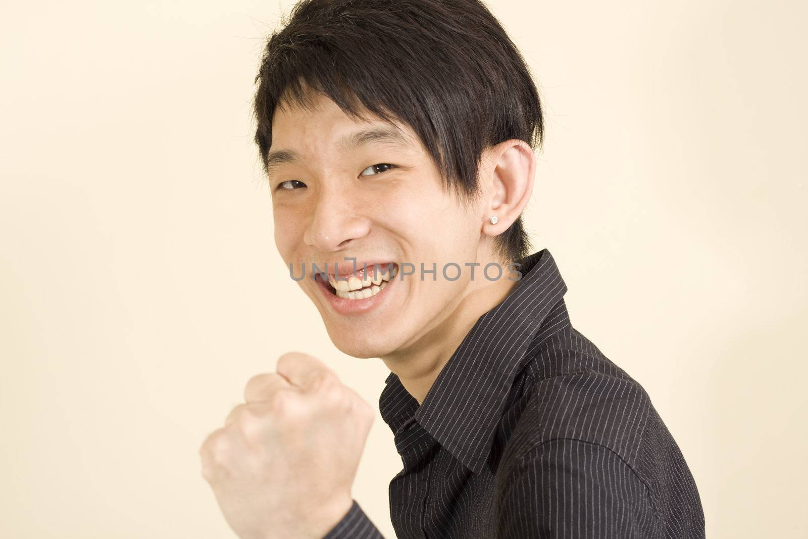 Young Asian man making fight by cozyta