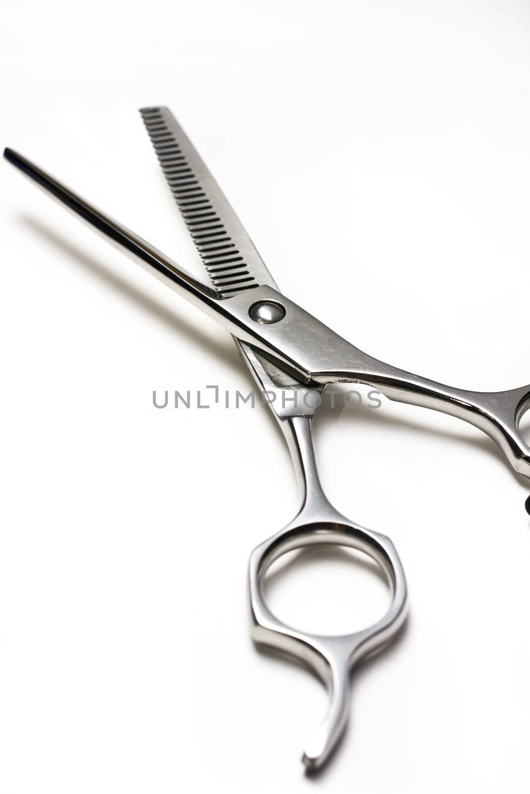 Special scissors for work of hairdresser on white