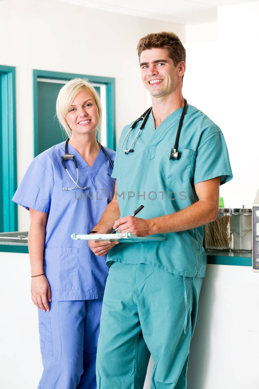 A portrait of a veterinarian and  assistant in a small animal clinic