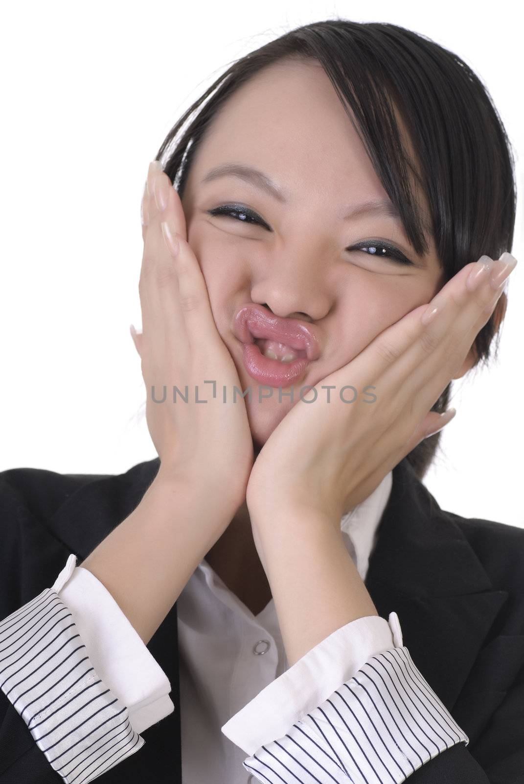 Young business woman with wry face on white background.
