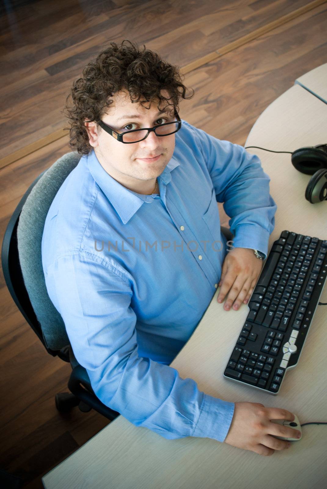 Young businessman working on a computer at the office.