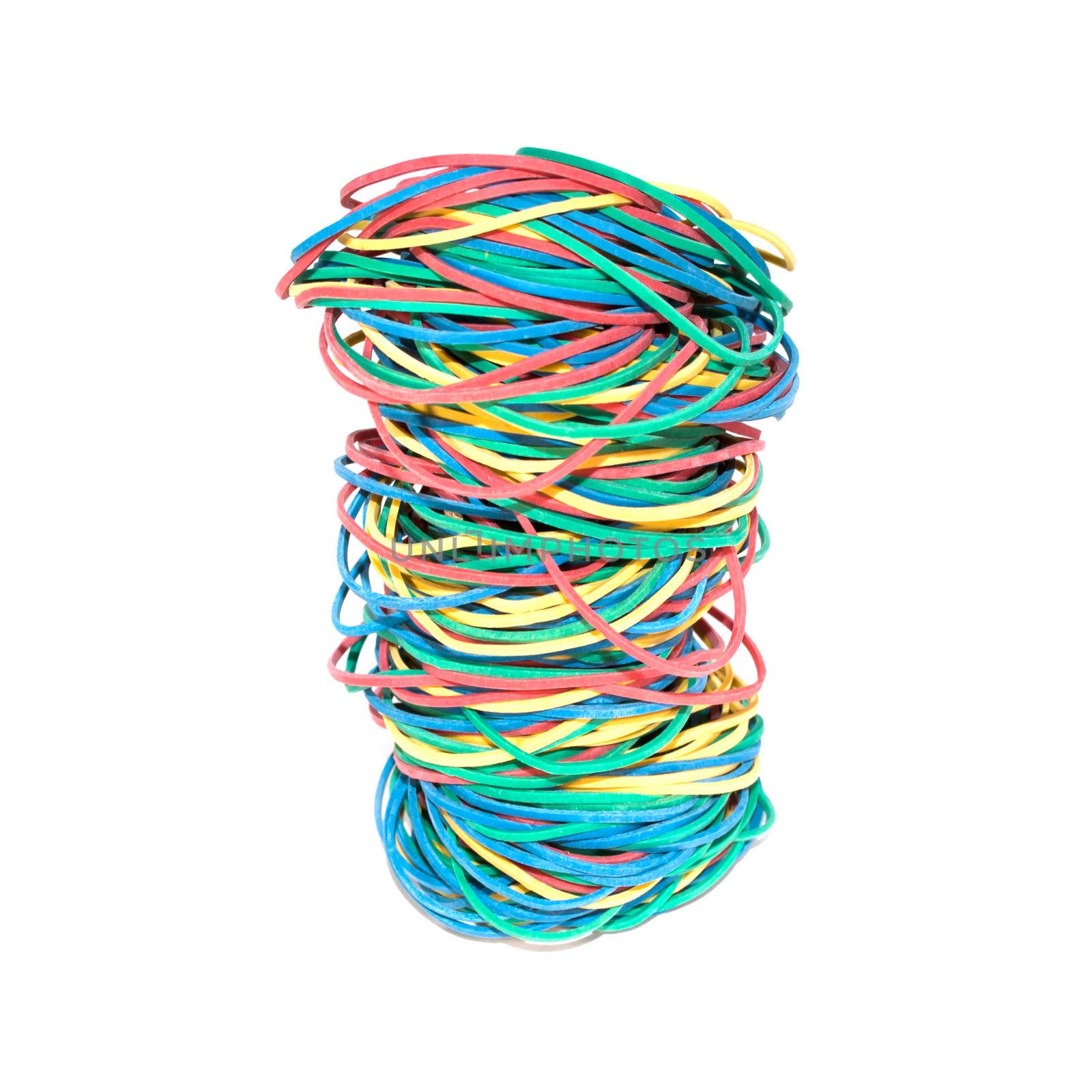 Set of multi-coloured elastic bands close up isolated on white