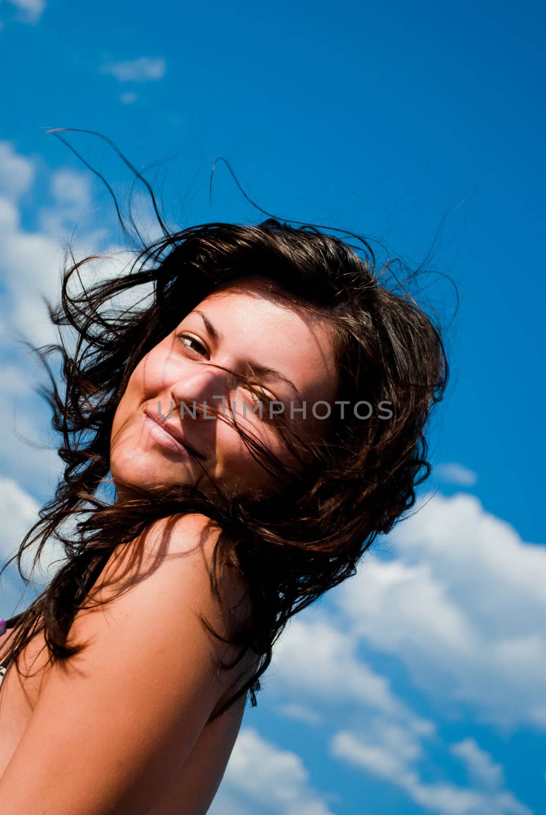 Young Woman over blue Sky by betterinall