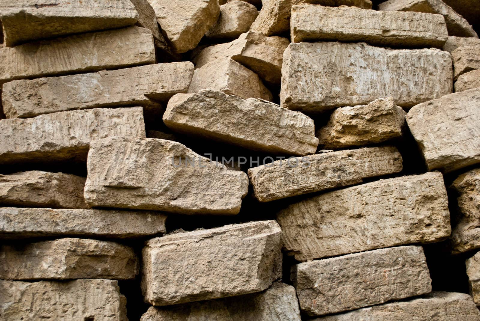Stacked pile of bricks by betterinall