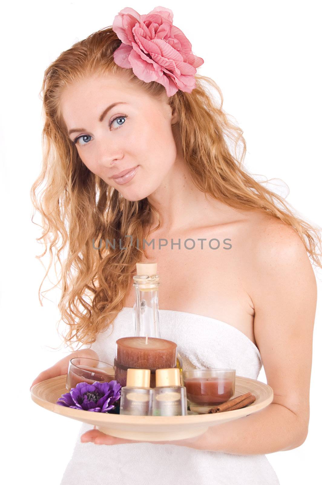 Woman with pink flower and spa products by Angel_a