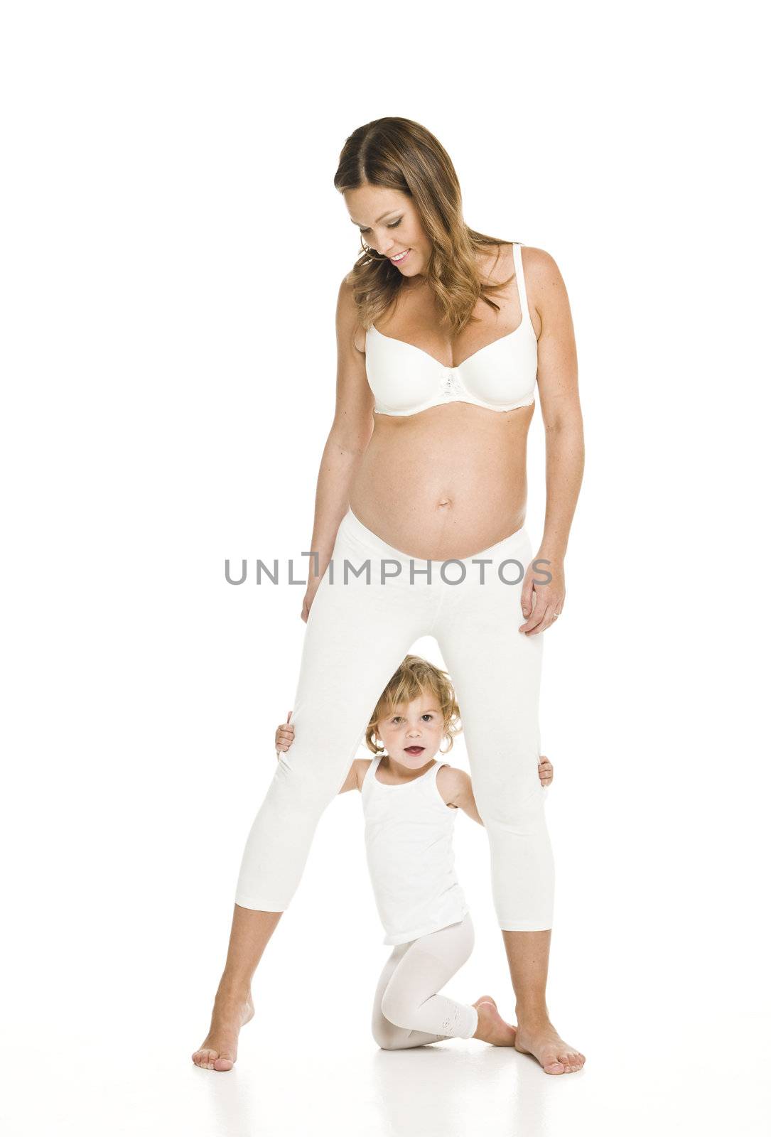 Pregnant woman with her daughter isolated on white background