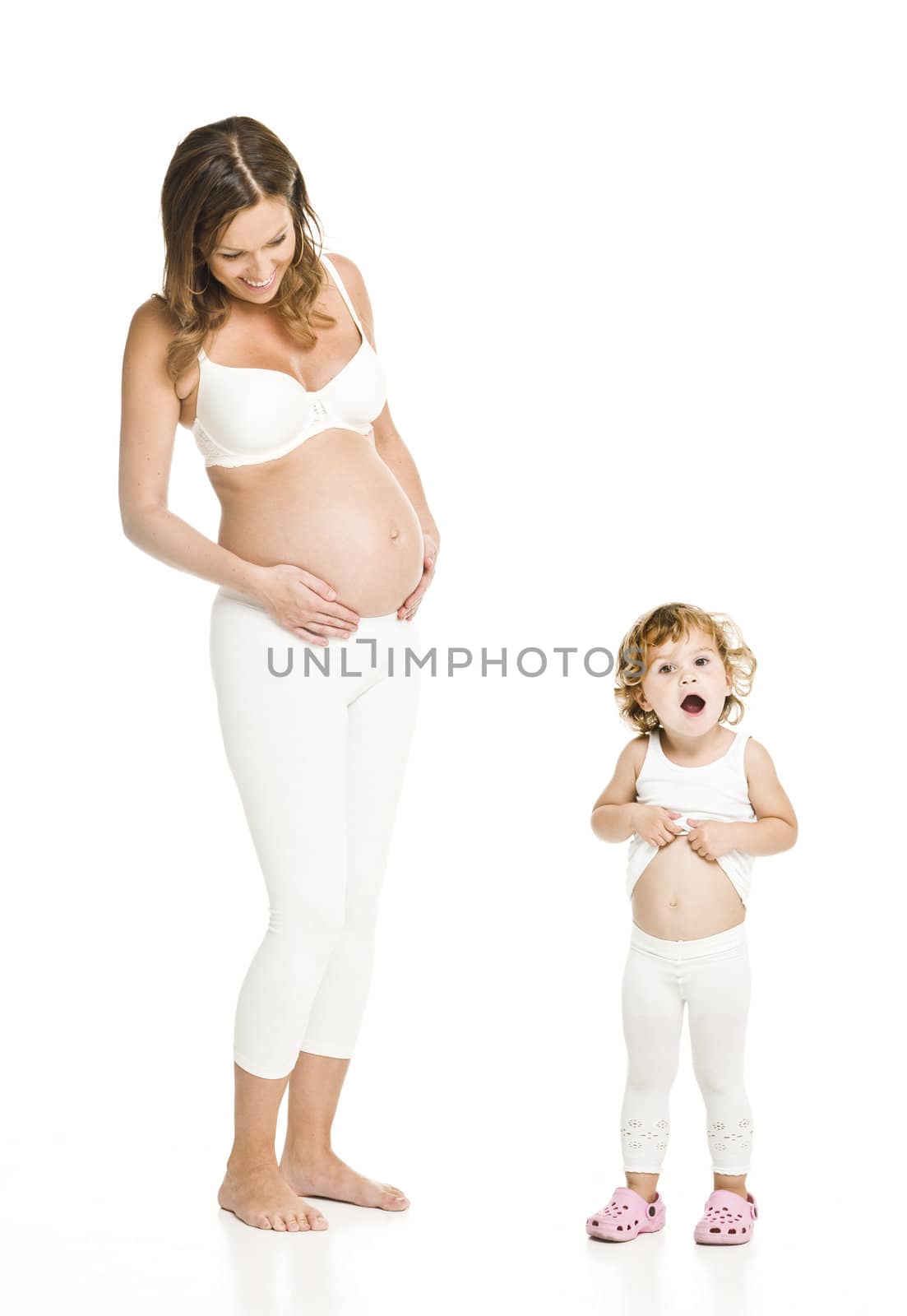 Pregnant woman with her daughter isolated on white background