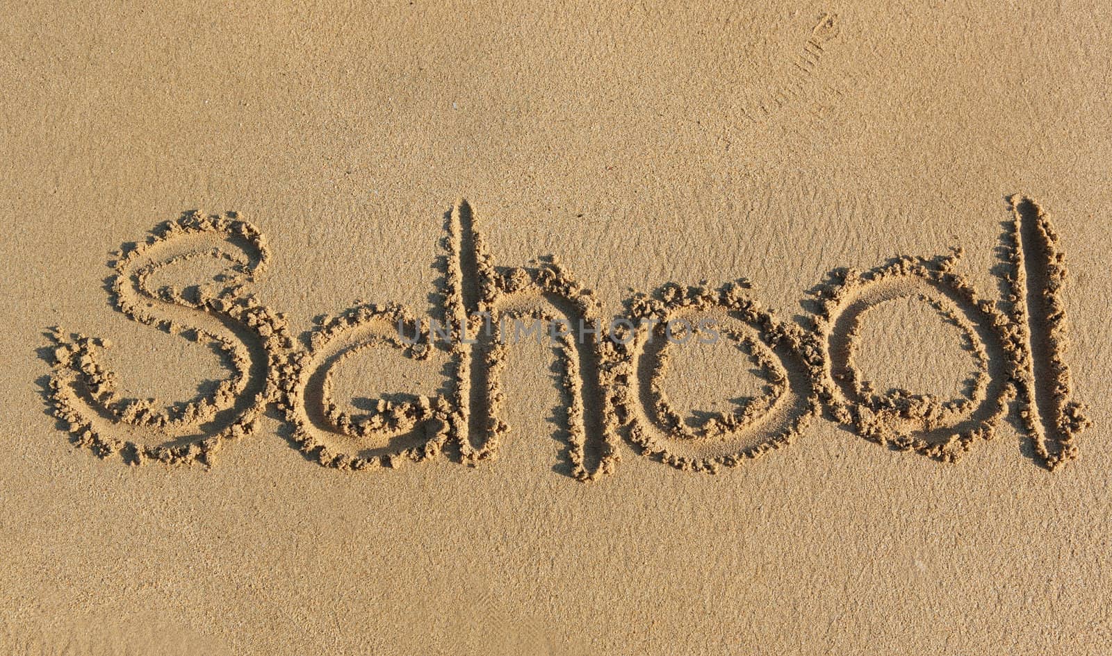 school written on sand