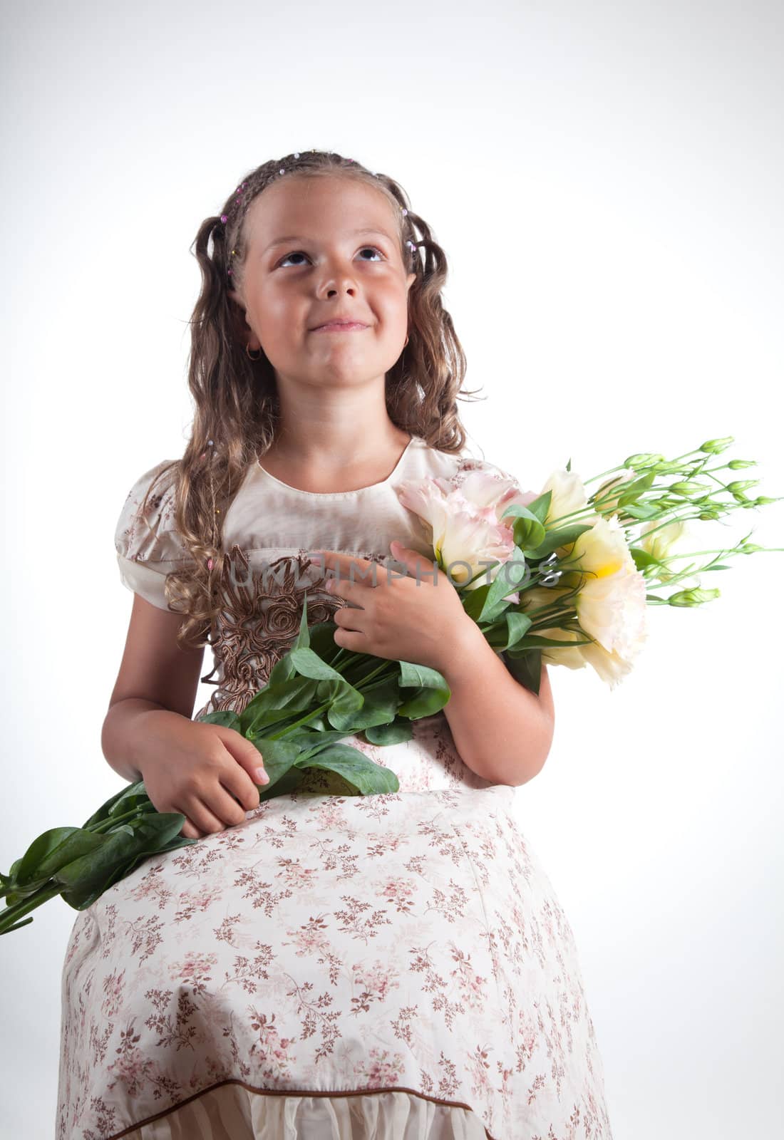 Little girl with flowers, studio shot  