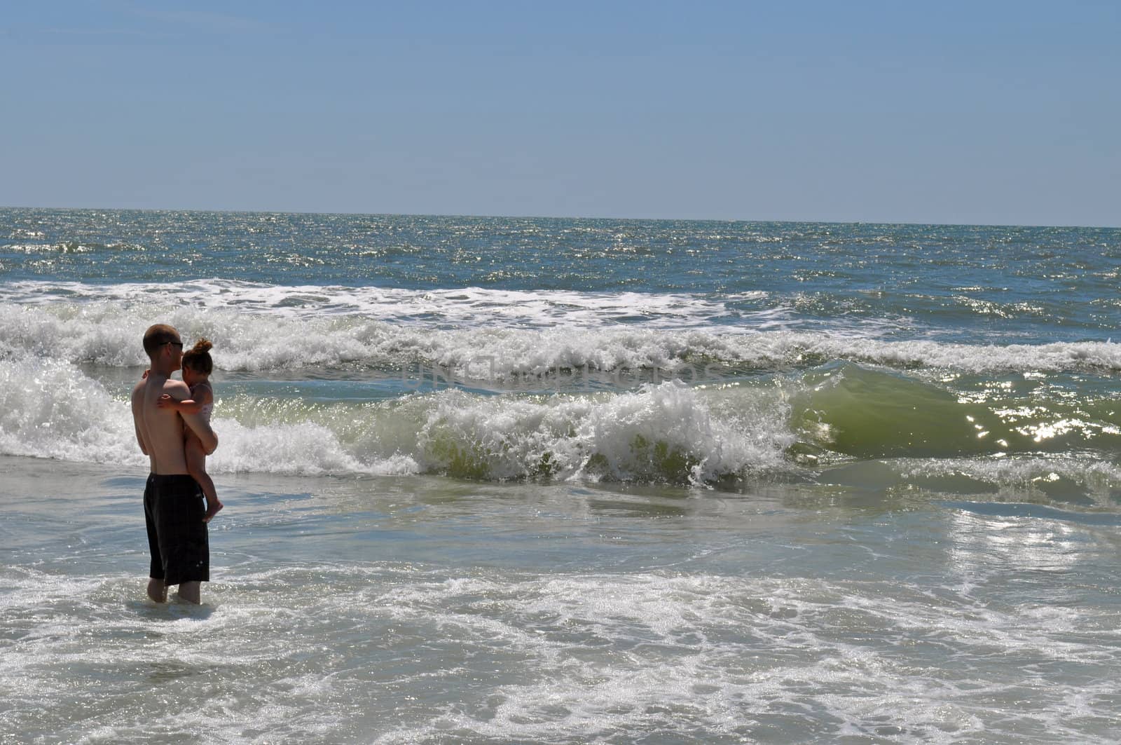 Father and Daughter first time in the waves