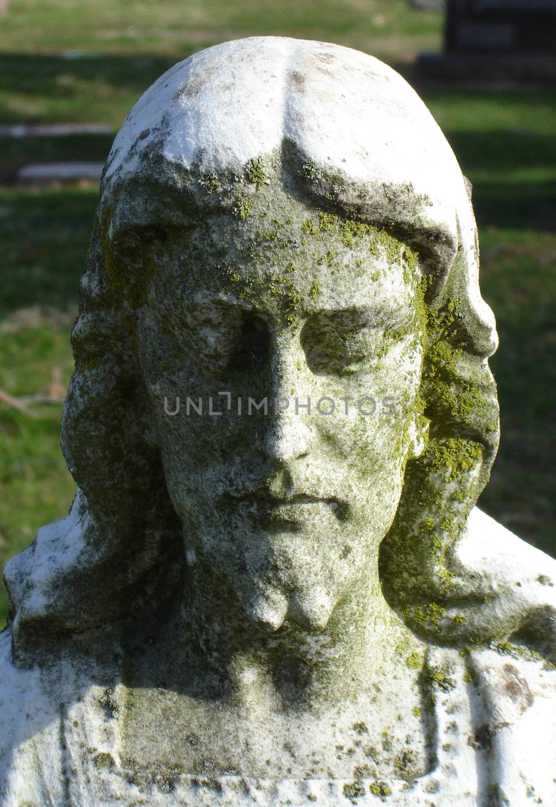 Jesus Statue inside a cemetary - head and shoulders by RefocusPhoto