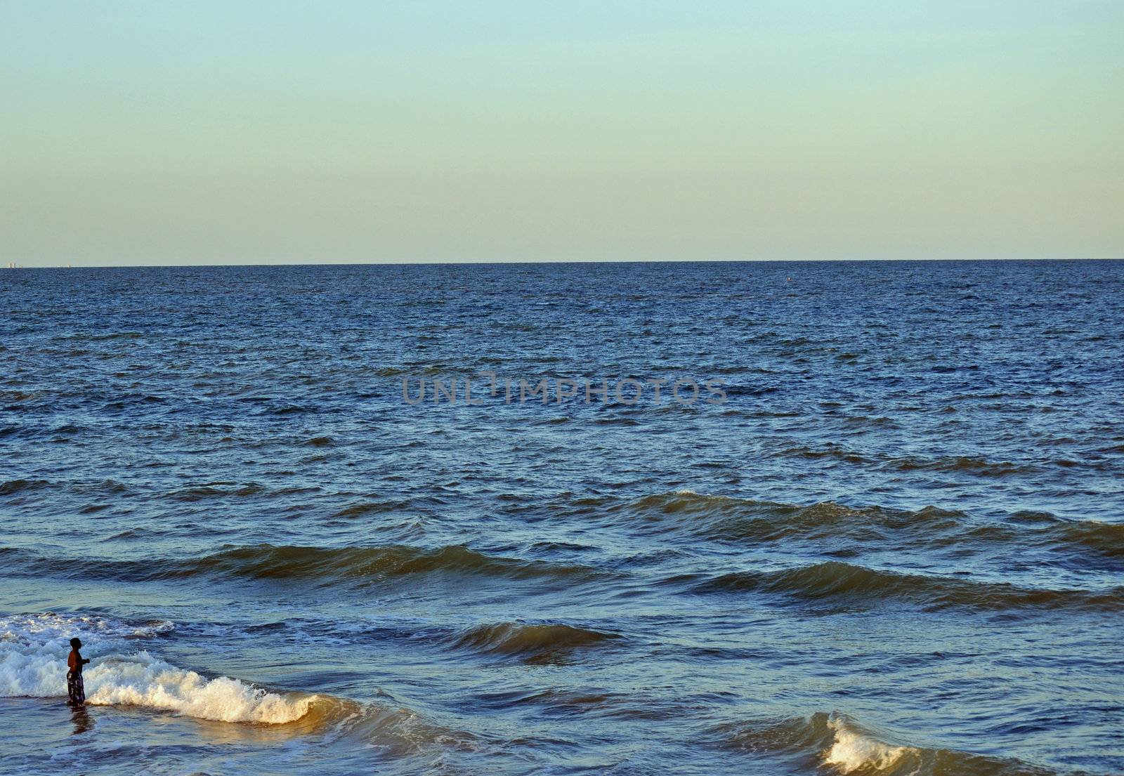 In the waves at dusk