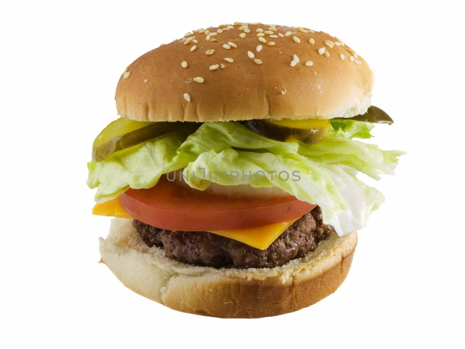 Cheeseburger with pickles, lettuce, onions, tomato, and cheese. Isolated on white