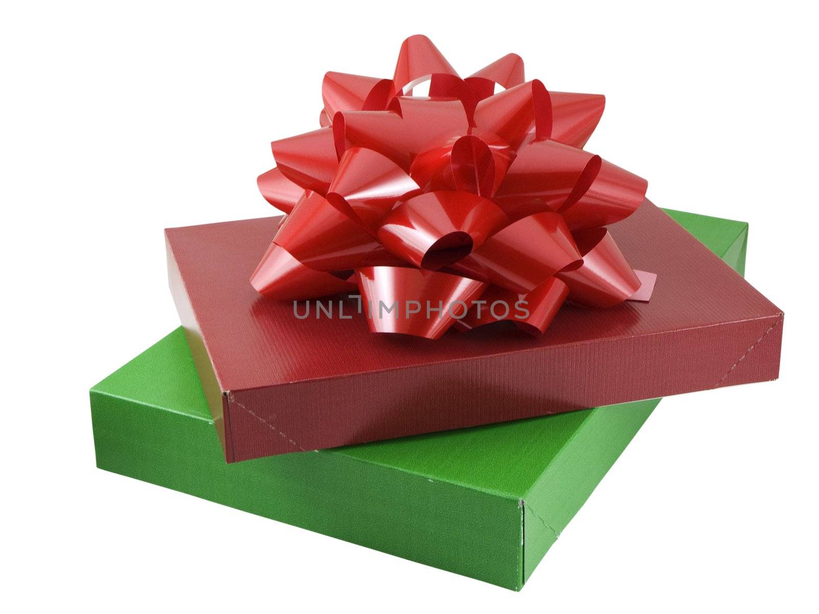 Red and green christmas presents with a large bow isolated on a white background