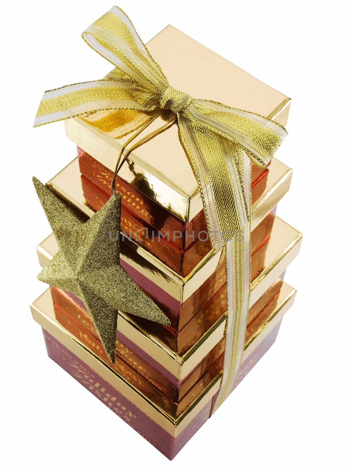 Christmas gift boxes stacked and tied with a ribbon, isolated on a white background