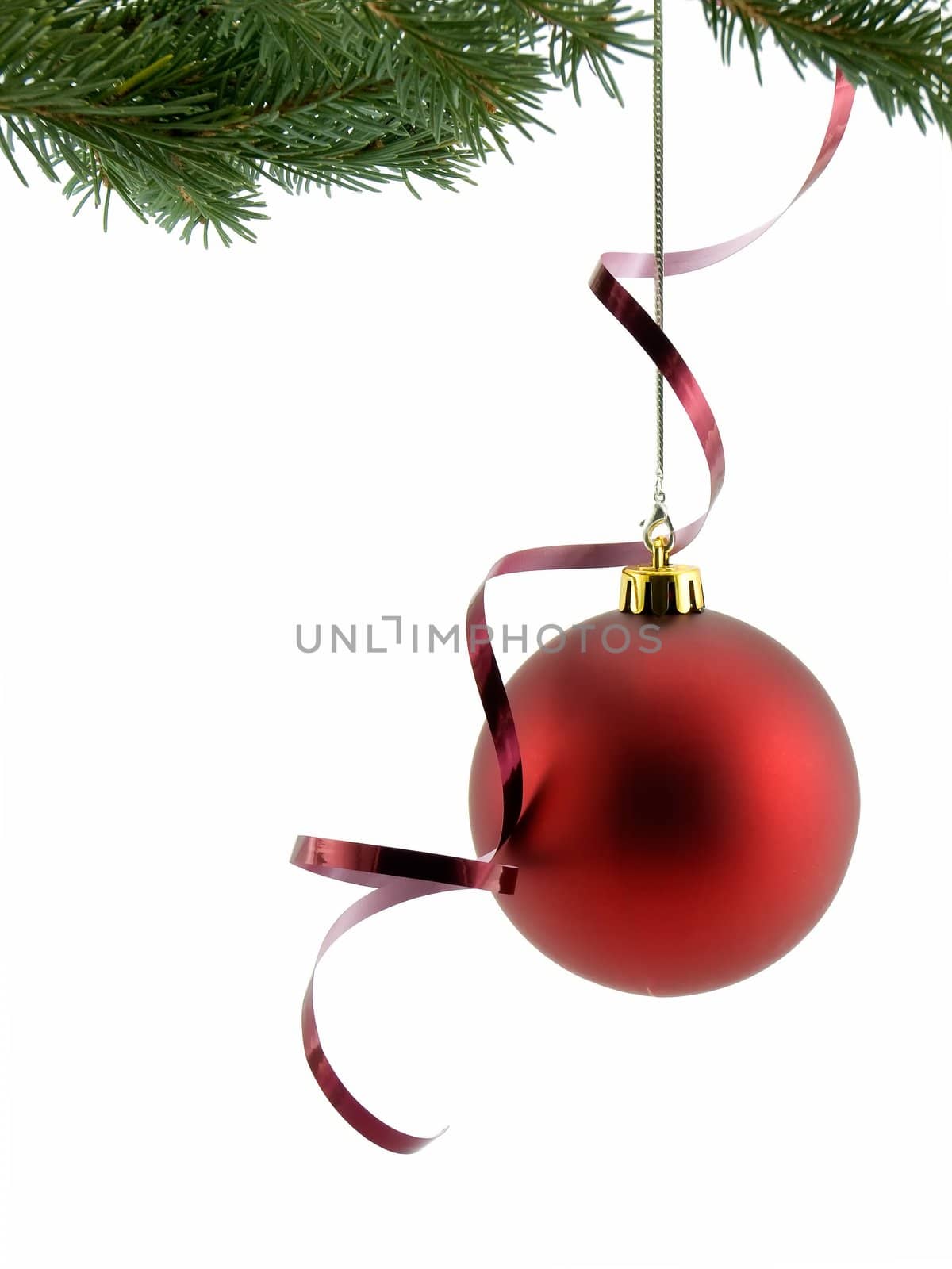 Red christmas ornament with ribbon, hanging from a tree, isolated on white