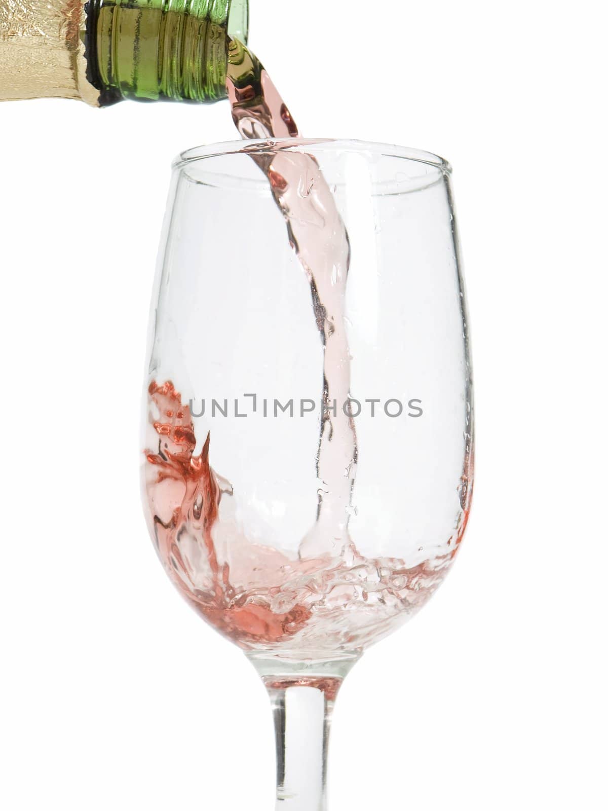 Glass of wine / champagne being poured with a white background