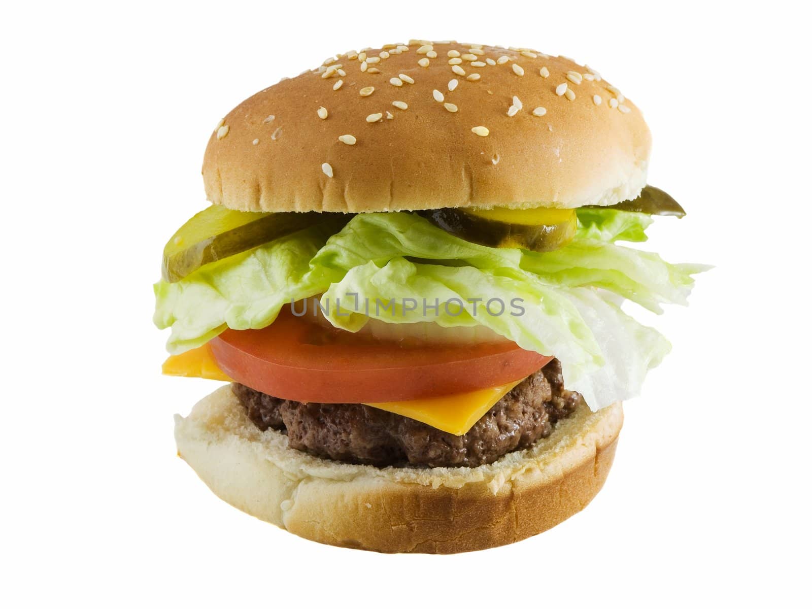 Cheeseburger with lettuce, onion, and tomatoes isolated on white